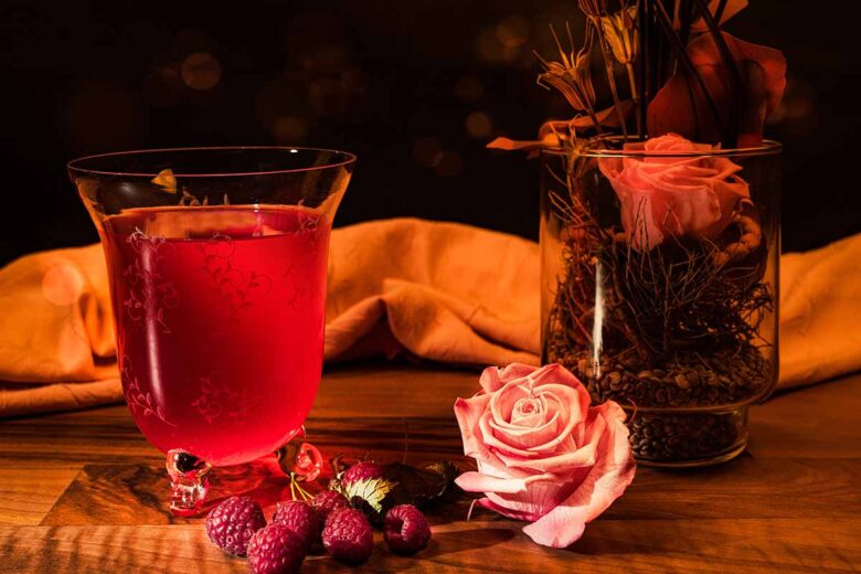 Wine and rose on table